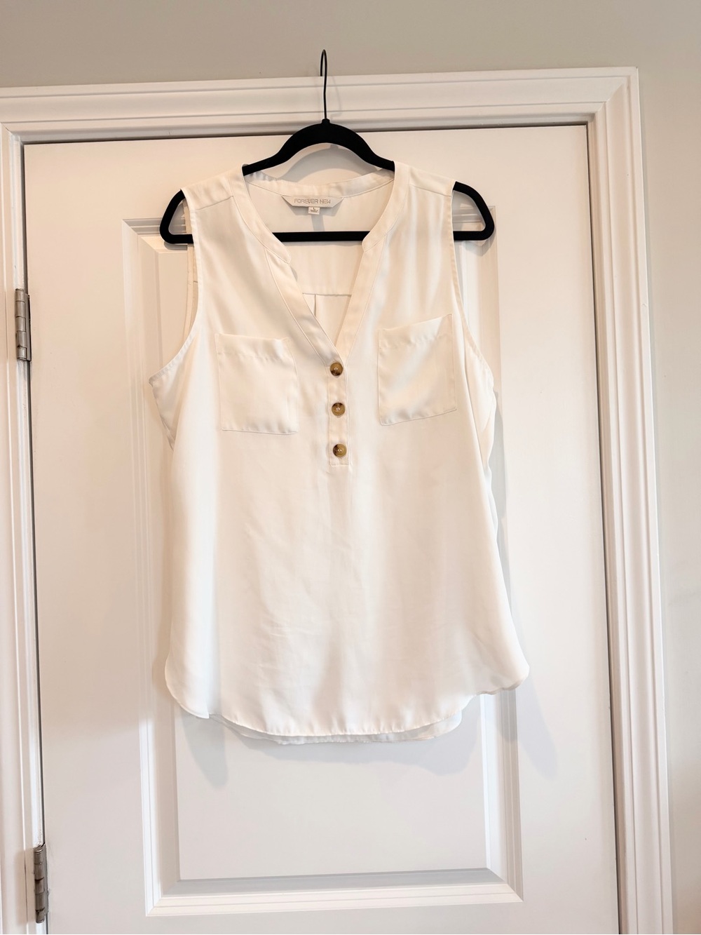 White sleeveless blouse